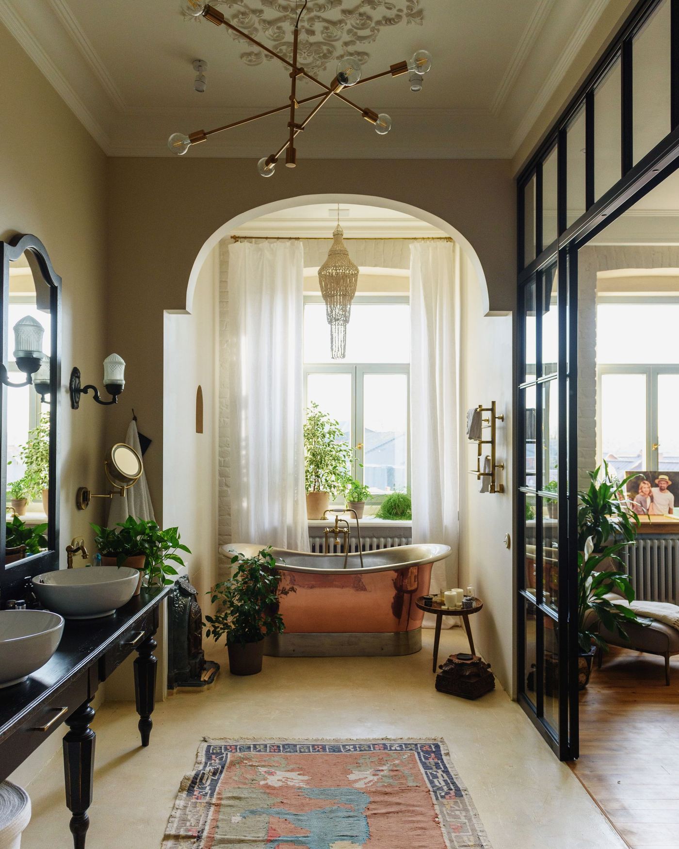 A renovated period home — original arch and cornice kept, Crittall-style glazing and a new bathroom fitted in