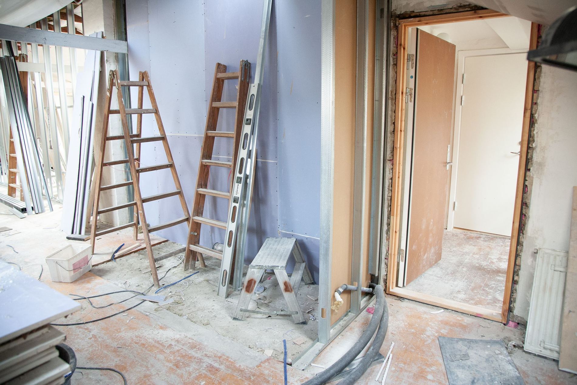 A house mid-renovation, stripped back and propped before the finishes go on